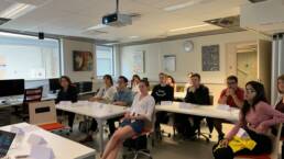 Students listening to a teacher